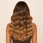 Back view of a brown-to-blonde ombre loose body wave human hair wig