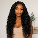 Black woman front view wearing UrbanChichair Virgin Natural Wave Bundles with long glossy natural black waves and a seamless natural finish.