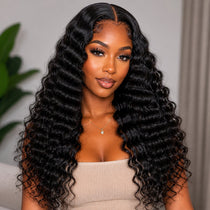 Black woman front view wearing long UrbanChichair deep wave tape-in hair extensions with glossy black waves and natural volume.