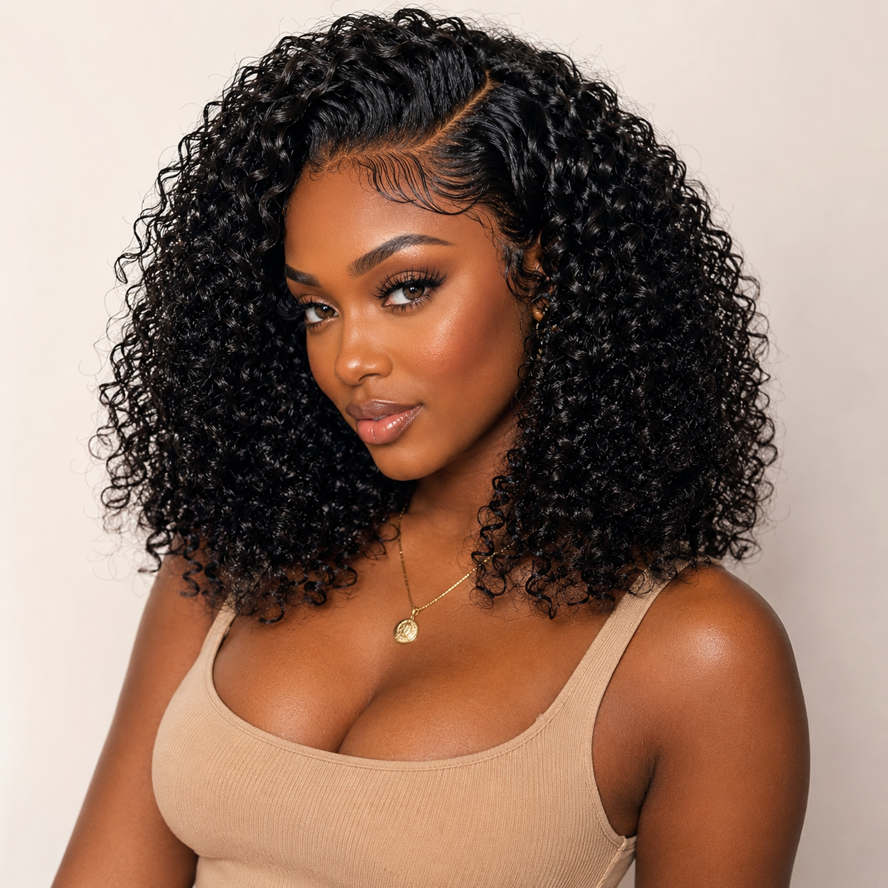 Black woman wearing Raw Pixie Curly Bundles Double Drawn with full defined black curls and a natural voluminous finish by UrbanChichair
