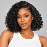 Black woman wearing UrbanChicHair Water Wave Short Curly Bob Glueless Human Hair Wig with defined black curls and natural-looking side part.