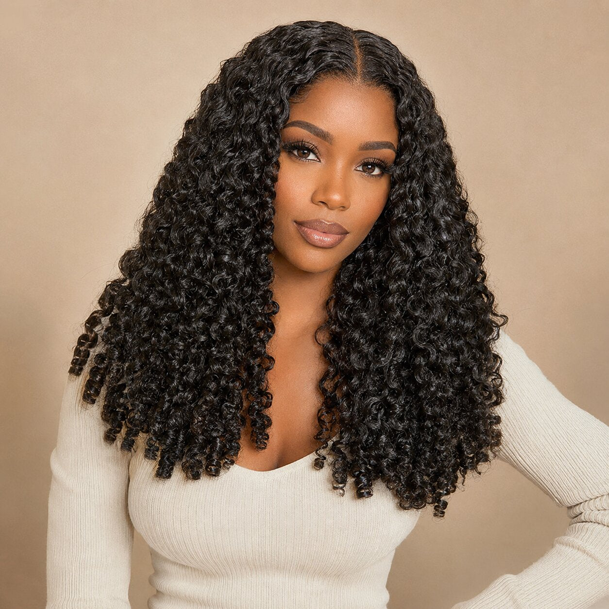 Black woman wearing UrbanChichair Burmese Curly Finger Coil Ends Seamless Clip-In Human Hair Extensions with defined natural black curls and a polished center part.