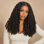 Black woman wearing UrbanChichair Burmese Curly Finger Coil Ends Seamless Clip-In Human Hair Extensions with defined natural black curls and a polished center part.