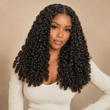Black woman wearing UrbanChichair Burmese Curly Finger Coil Ends Seamless Clip-In Human Hair Extensions with defined natural black curls and a polished center part.