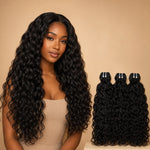 Black woman wearing UrbanChichair Raw Natural Wave Bundles with long glossy natural black waves beside matching 3 bundle hair extensions