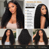 Black woman wearing UrbanChichair Virgin Indian Curly Bundles with long natural black curly hair, soft shine, full volume, and defined bouncy curls.