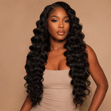 Black woman wearing UrbanChichair Virgin Loose Deep Wave Bundles with long glossy loose deep wave hair and natural voluminous finish