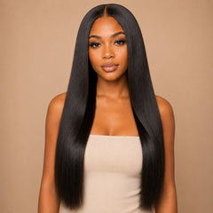 Black woman wearing UrbanChichair Yaki Straight clip-in hair extensions with sleek middle part and natural black straight hair