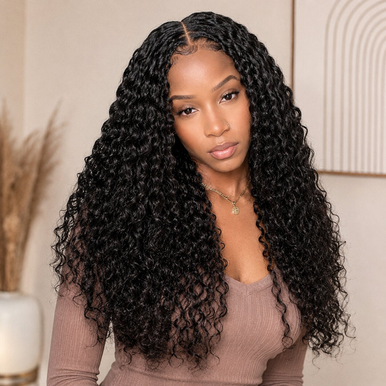 Black woman wearing UrbanChichair water wave crochet human hair beside product bundle and invisible loop strand detail.