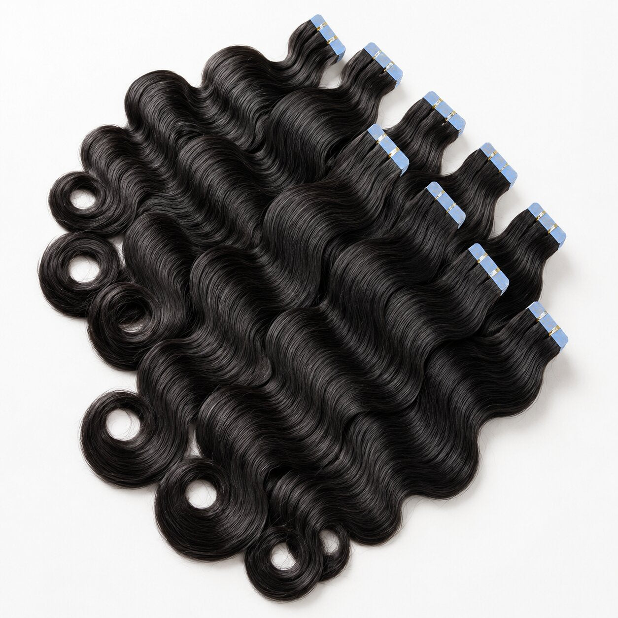Body Wave Invisible Tape In Hair Extensions by UrbanChichair, glossy black human hair tape-ins with soft waves and blue protective tape tabs