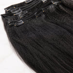 Close-up detail of UrbanChichair Yaki Straight Clip-In Human Hair Extensions showing soft yaki texture and natural black human hair