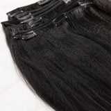 Close-up detail of UrbanChichair Yaki Straight Clip-In Human Hair Extensions showing soft yaki texture and natural black human hair