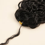 Close-up of Natural Wave Human Crochet Hair bundle root with a gold spiral wrap and fine strand tail.