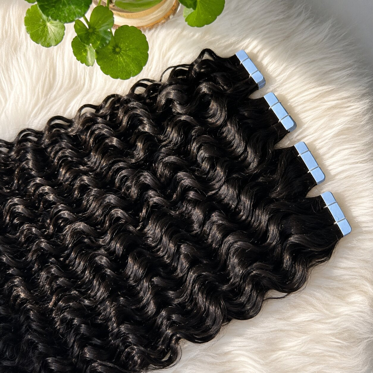 Close-up of Water Wave Tape In Hair Extensions with shiny defined wave texture and premium tape-in adhesive tabs
