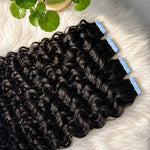 Close-up of Water Wave Tape In Hair Extensions with shiny defined wave texture and premium tape-in adhesive tabs
