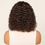 Close-up of dark water wave strands with warm brown highlights.