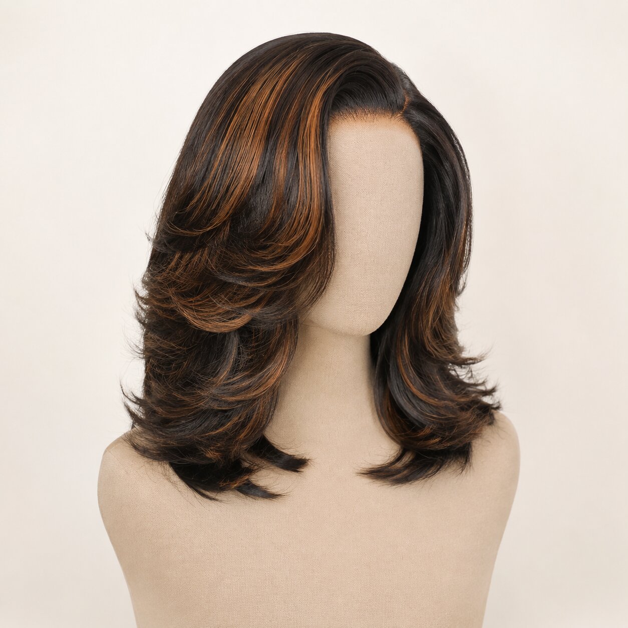 Close-up of smooth dark brown human hair with warm caramel highlights and layered feathered ends.