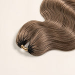 Close-up of soft #8 light brown body wave human hair texture