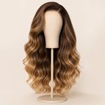Close-up of the pre-finished hairline and left side part on a brown highlight HD lace wig