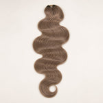 Close-up of the pre-looped construction on #8 light brown body wave crochet hair