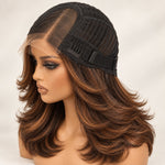 Concept image of a glueless wig cap showing black mesh, a narrow lace area and an elastic band.