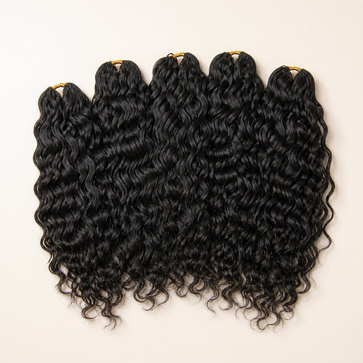 Five bundles of UrbanChichair natural black Natural Wave Human Crochet Hair on a warm ivory background.