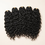 Five bundles of UrbanChichair natural black Natural Wave Human Crochet Hair on a warm ivory background.
