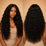 Front and back view of Black woman wearing UrbanChichair Raw Natural Wave Bundles showing full length, soft waves and glossy natural black texture