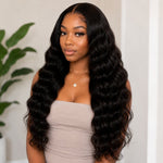 Front portrait of Black woman wearing long Cambodian Wave tape in hair extensions with glossy black waves and natural-looking volume