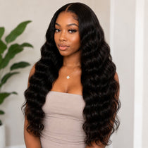 Front portrait of Black woman wearing long Cambodian Wave tape in hair extensions with glossy black waves and natural-looking volume