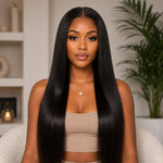 Front portrait of Black woman with sleek long straight human hair extensions, featuring silky smooth texture and natural middle part hairstyle.