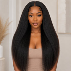 Front view of Black woman wearing long kinky straight tape in human hair extensions with natural volume and soft textured finish