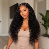 Front view of a Black woman wearing UrbanChichair Virgin Indian Curly Bundles with long natural black curls, glossy shine, and a seamless full look.