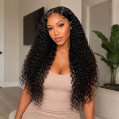 Front view of a Black woman wearing UrbanChichair Virgin Indian Curly Bundles with long natural black curls, glossy shine, and a seamless full look.