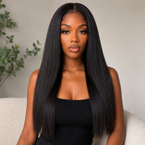 Front view of a Black woman wearing long natural black Yaki Straight tape in hair extensions with a sleek middle part and soft realistic texture by UrbanChichair.