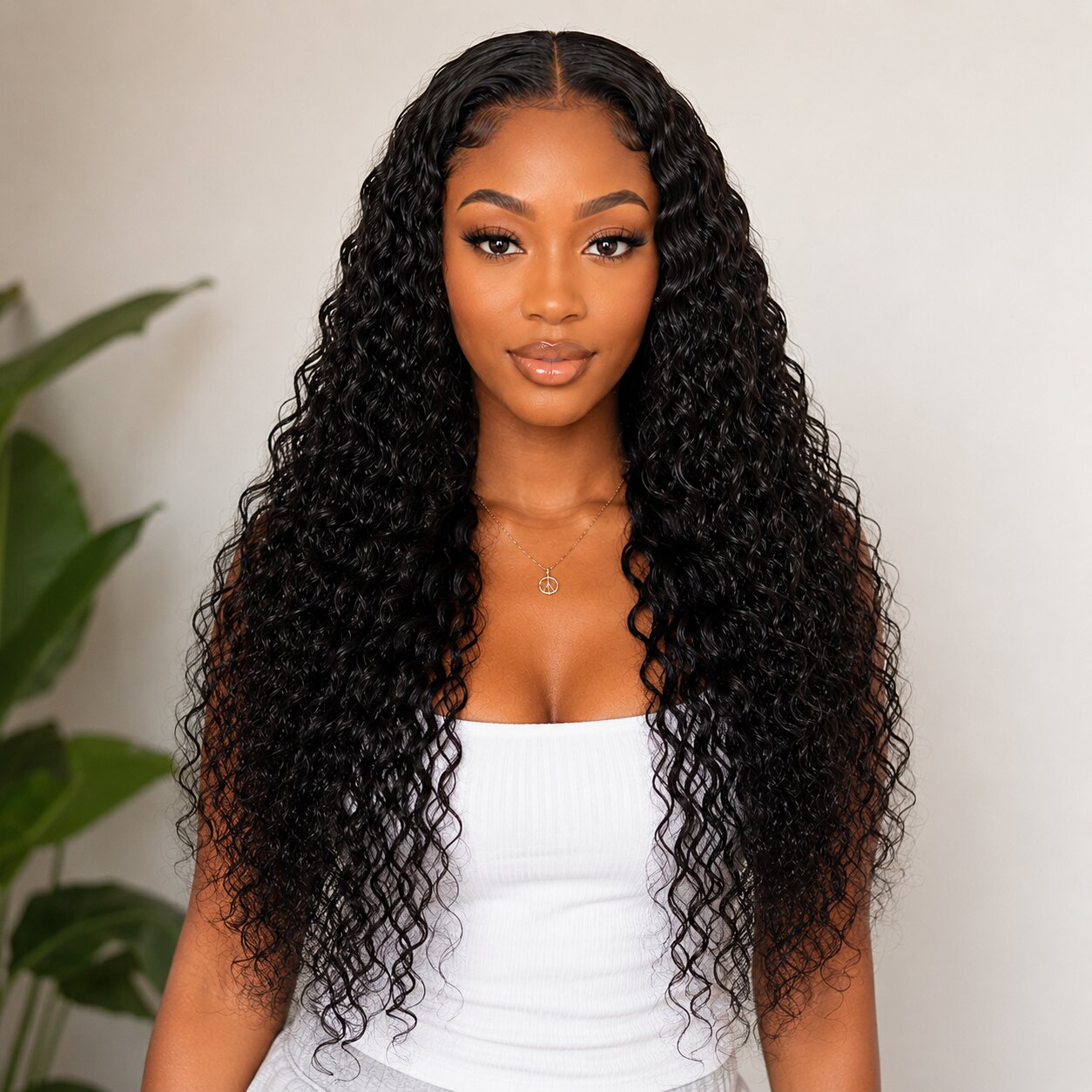 Front view of model wearing Water Wave Tape In Hair Extensions with long defined black waves and natural-looking volume