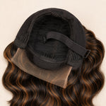 Interior construction concept of a brown highlight glueless wig with minimalist lace, combs, elastic band and adjustable straps.