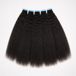 Kinky straight tape in hair extensions flat lay showing full double drawn human hair wefts with natural texture and thick ends