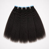 Kinky straight tape in hair extensions flat lay showing full double drawn human hair wefts with natural texture and thick ends
