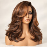 Model wearing a brown highlight butterfly cut wig with a side-swept fringe and layered ends.