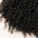 Seven UrbanChichair pre-separated kinky curly crochet hair strands with slim looped tops for easy installation