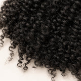 Seven UrbanChichair pre-separated kinky curly crochet hair strands with slim looped tops for easy installation