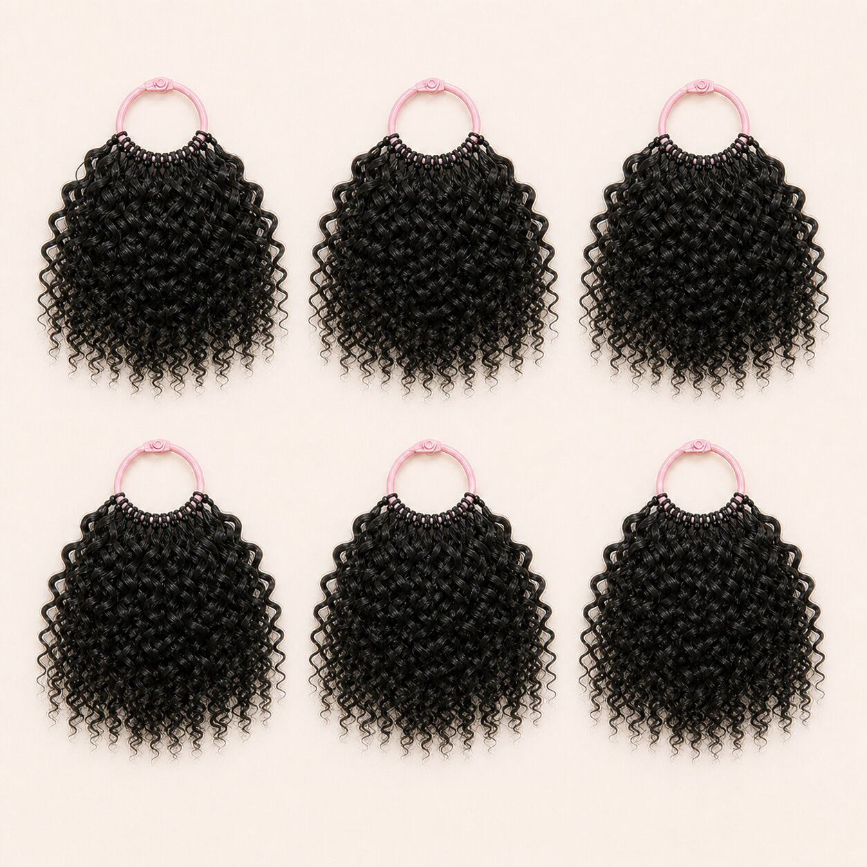 Six bundles of Spanish Curl human hair crochet strands arranged for a full installation