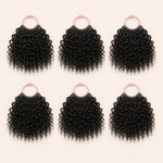 Six bundles of Spanish Curl human hair crochet strands arranged for a full installation