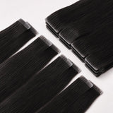 Straight Invisible Tape In Hair Extensions laid flat, showing smooth black human hair with seamless invisible tape tabs.
