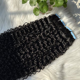 Top-down flat lay of curly black tape-in hair extensions arranged neatly on a soft white faux-fur background. Icons highlight product features: 100% virgin human hair, lightweight & comfortable, reusable, heat styling friendly, strong tape for long-lasting hold.