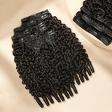 UrbanChichair Burmese Curly Finger Coil Ends Seamless Clip-In Human Hair Extensions in natural black, displayed in a premium flat lay with defined curls and visible clip-in wefts.