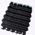 UrbanChichair Cambodian Wave tape in hair extensions flat lay showing natural black human hair with soft waves and seamless tape tabs