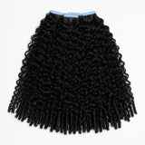 UrbanChichair Eurasian Curly Tape In Hair Extensions in natural black human hair with full double drawn curls on a clean white background.