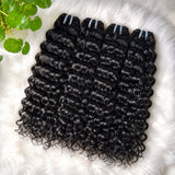 UrbanChichair Virgin Water Wave Bundles Double Drawn flat lay showing glossy natural black water wave human hair bundles on a white fur background.